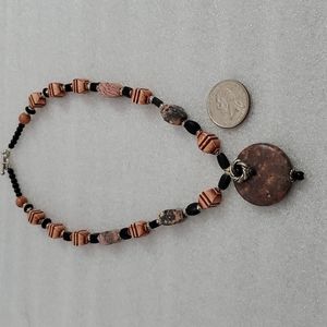 Hand crafted Necklace with silver caps and semi precious stones.